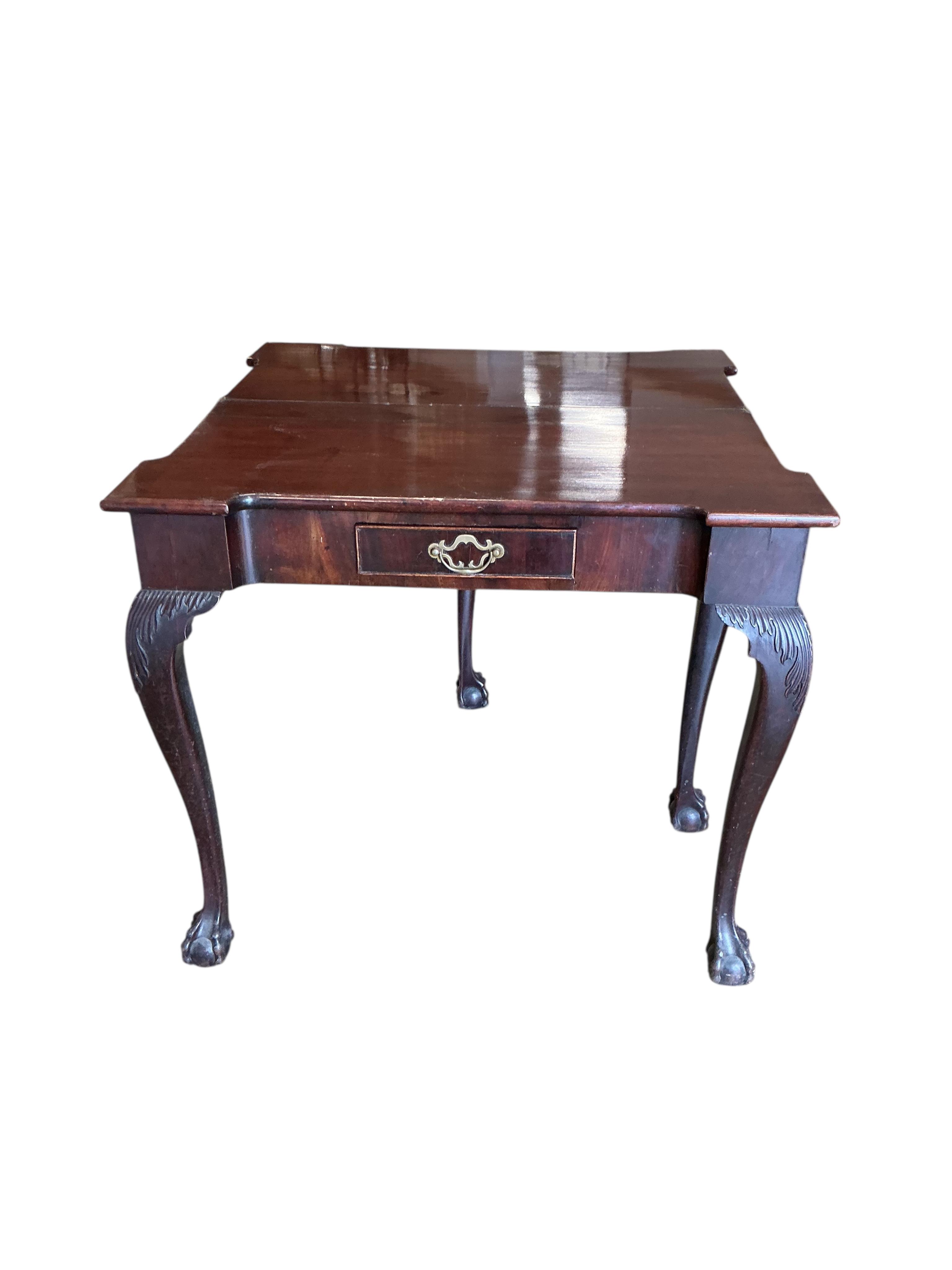 An 18th century rectangular mahogany folding tea table, width 80cm, depth 40cm, height 72cm